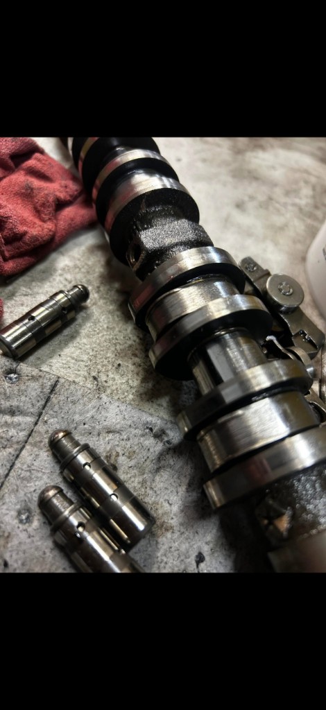 Camshaft and hydraulic lifters removed for repair